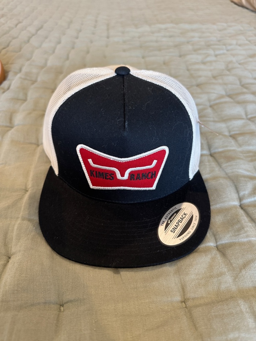 Kimes Ranch Black & White Trucker Hat with Red Patch